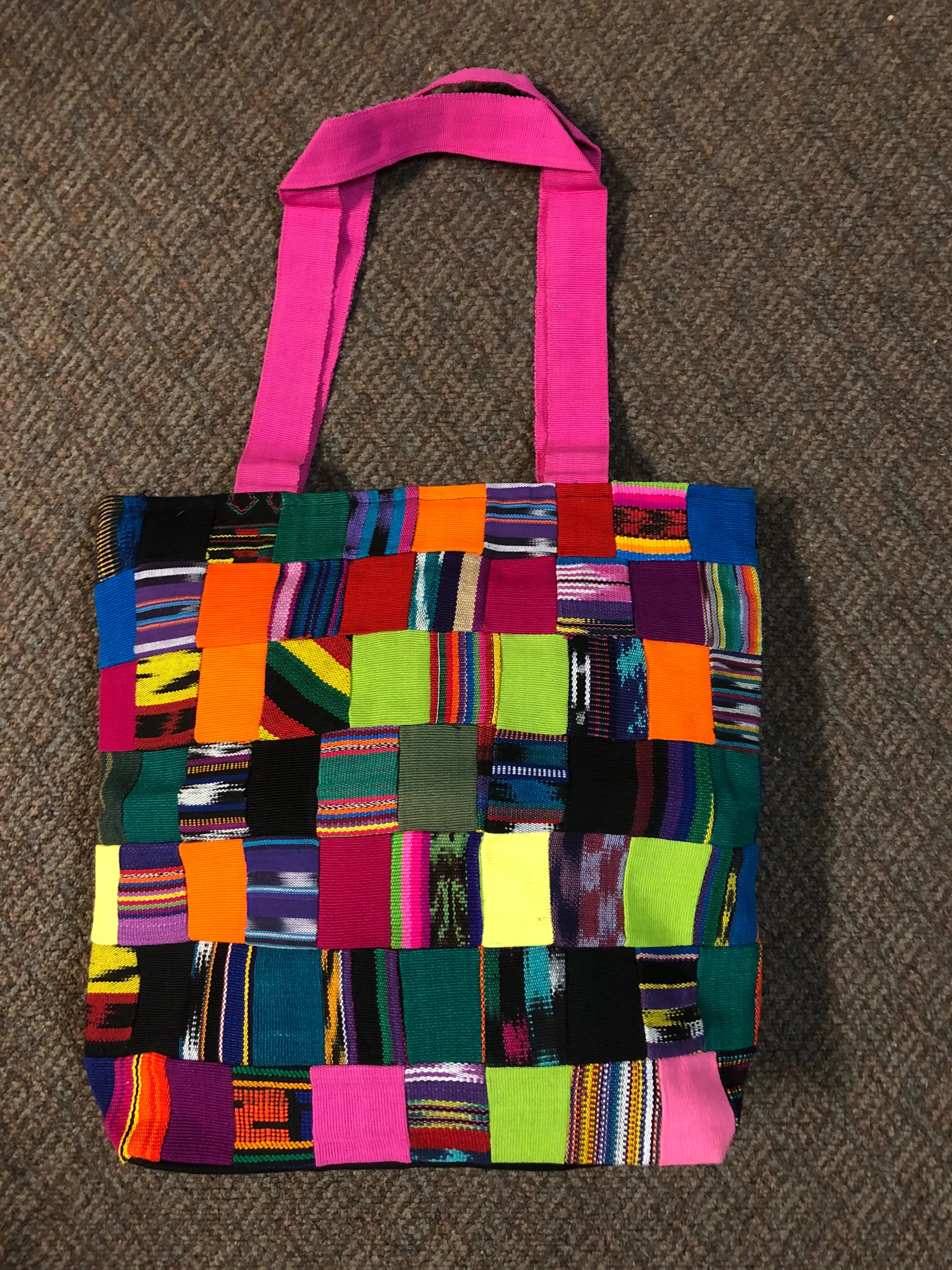 Handwoven Guatemalan cotton patches fashioned into a sturdy shoulder bag, fully lined with one zipper pocket. 15” x 17”