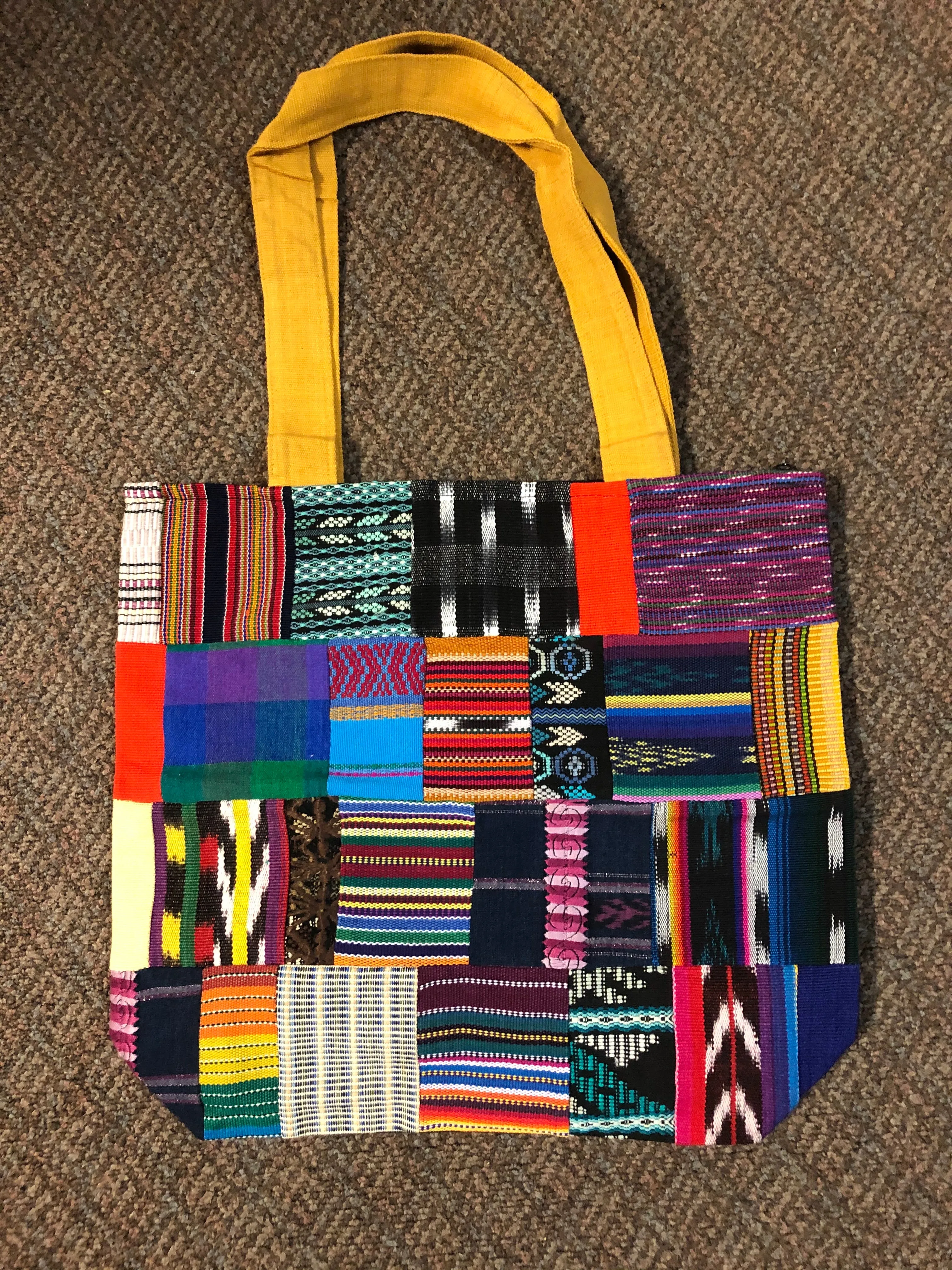 Handwoven Guatemalan cotton patches fashioned into a sturdy shoulder bag, fully lined with one zipper pocket. 15” x 17”