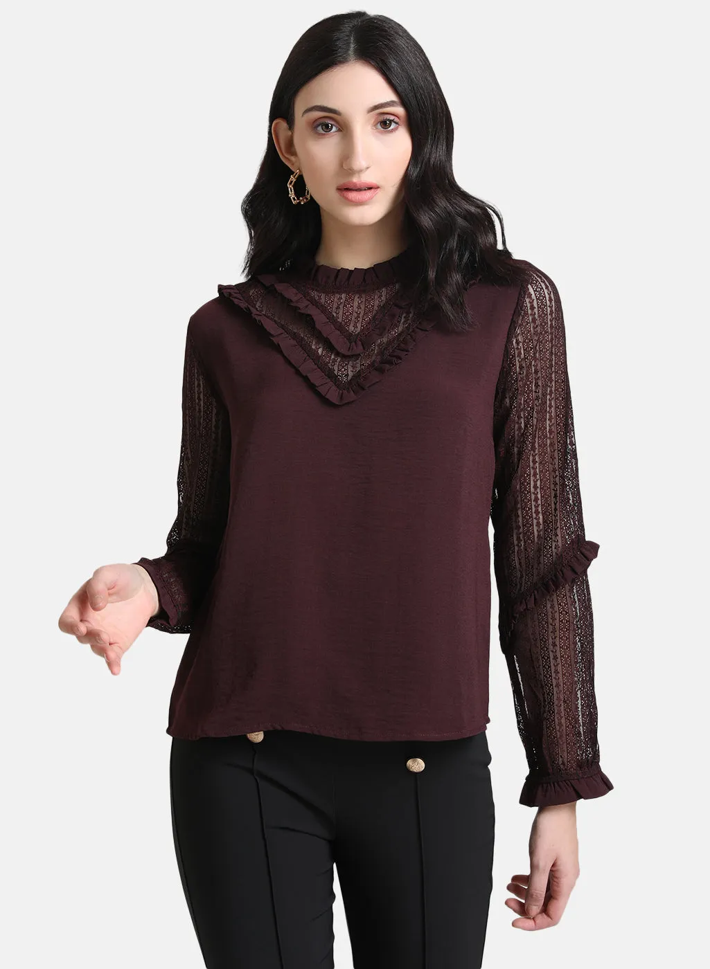 Top With Ruffles At Neck And Sleeves.