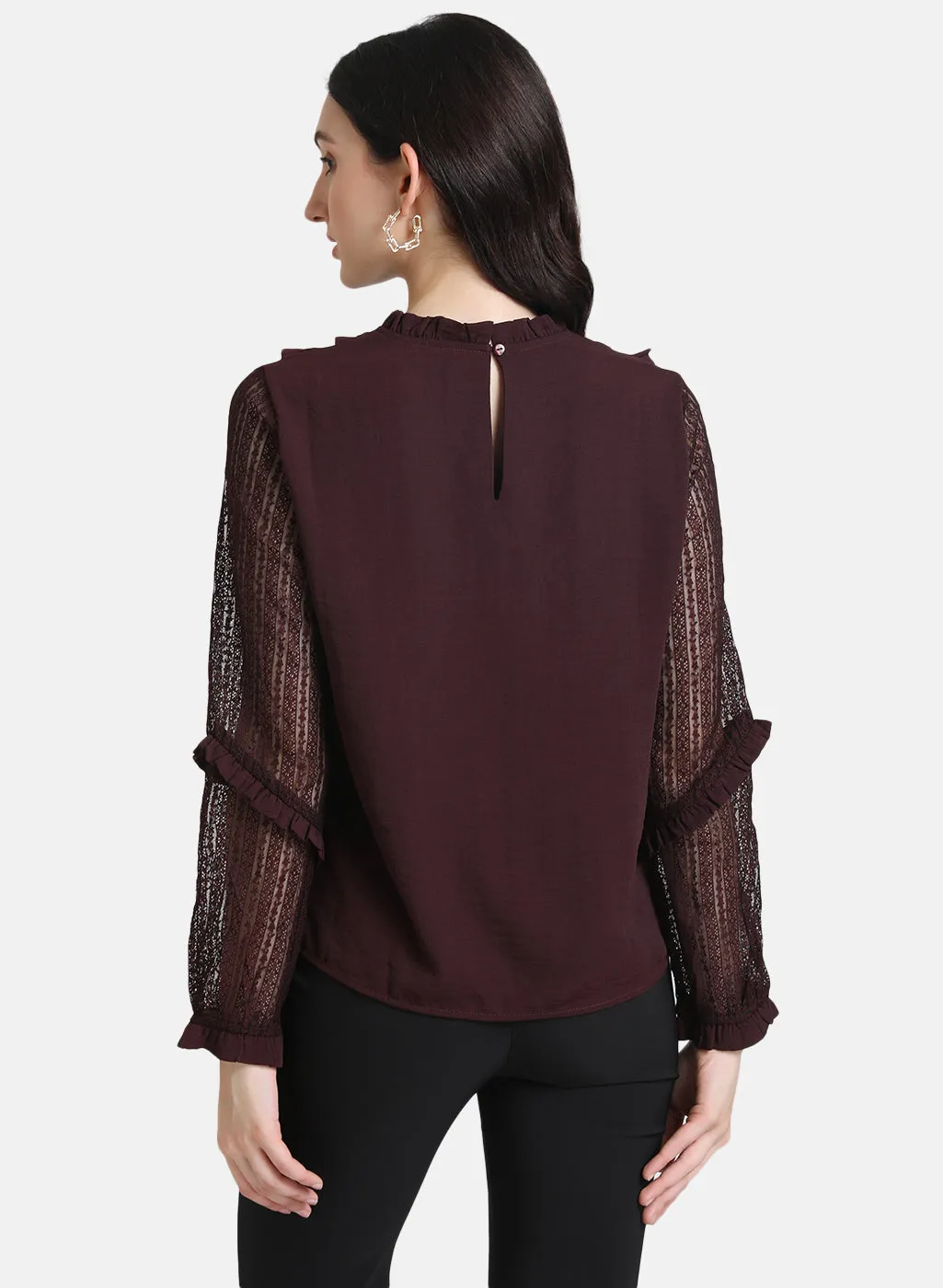 Top With Ruffles At Neck And Sleeves.