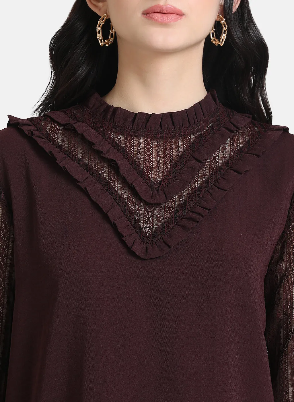 Top With Ruffles At Neck And Sleeves.